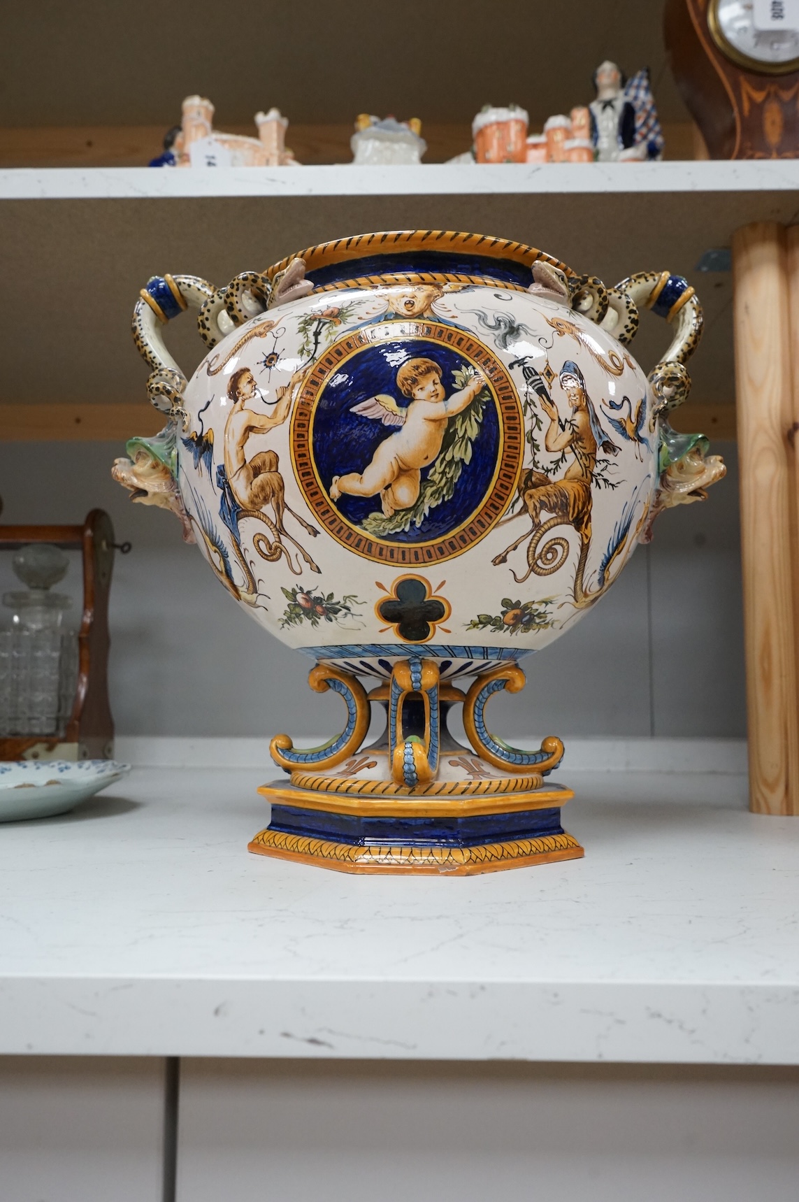 A large Ginori maiolica two handled pedestal vase, 34cm from base to top of handles
